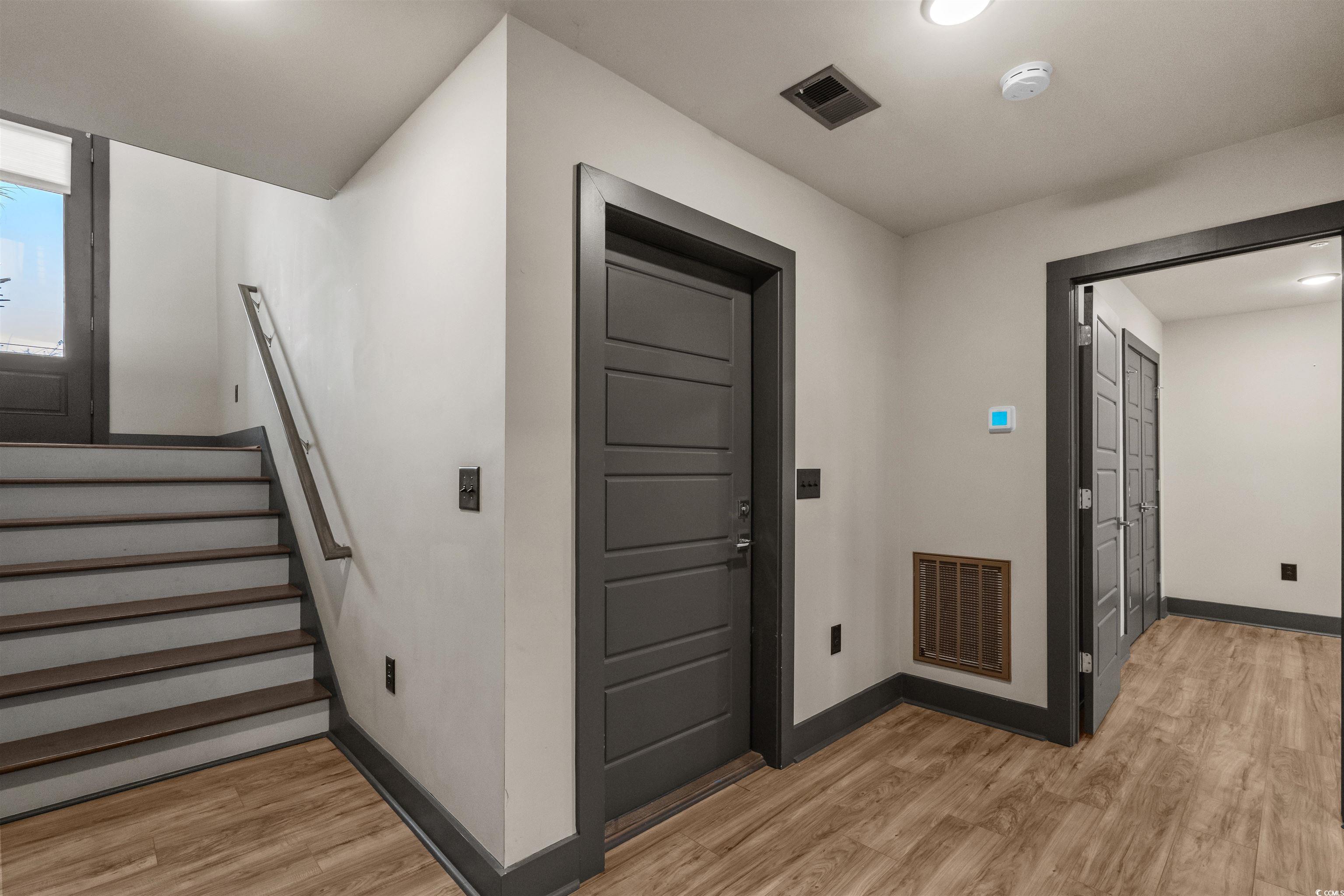 80 Shady Oak Lane Murrells Inlet, SC 29576 - Photo 25 of 31 Foyer entrance with light wood finished floors, stairs, and recessed lighting