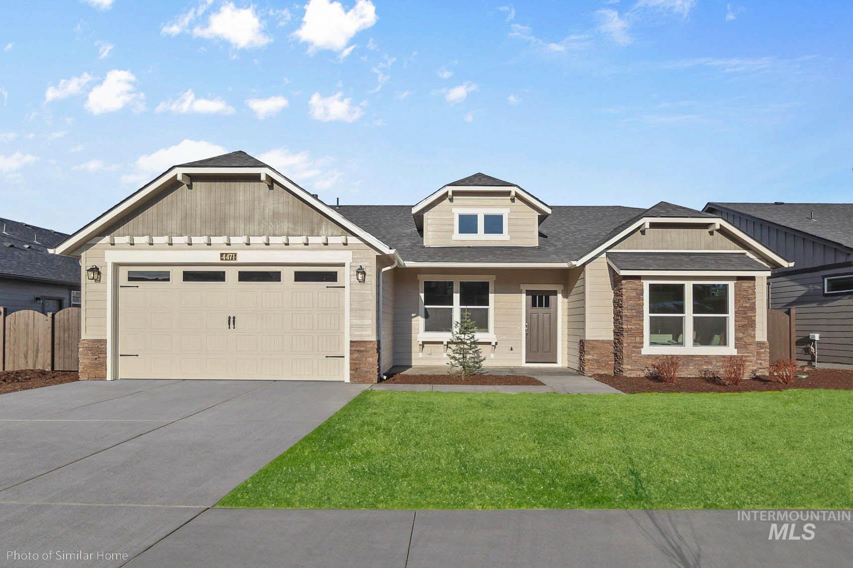 418 Lone Oak Street Middleton, ID 83644 - Photo 1 of 20 Craftsman house with driveway, a garage, brick siding, and roof with shingles