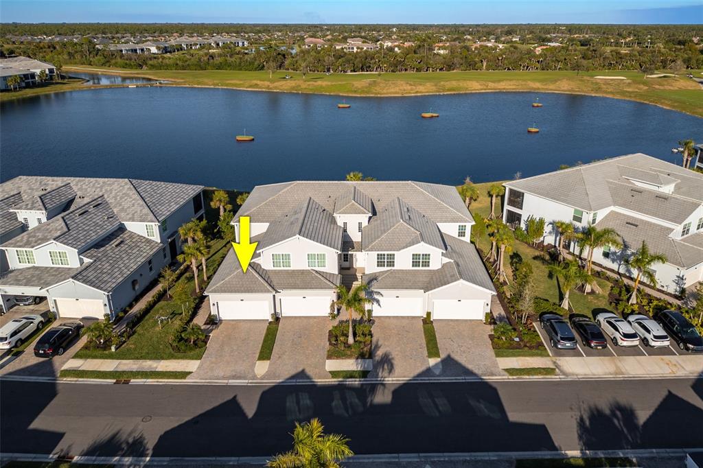 an aerial view of a house with a ocean view