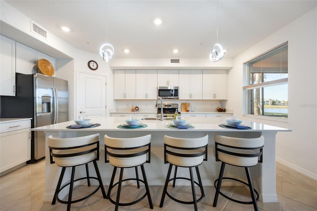 14186 Poppy Fld Loop, Unit 4911 Punta Gorda, FL 33955 - Photo 17 of 48 a kitchen with sink and cabinets