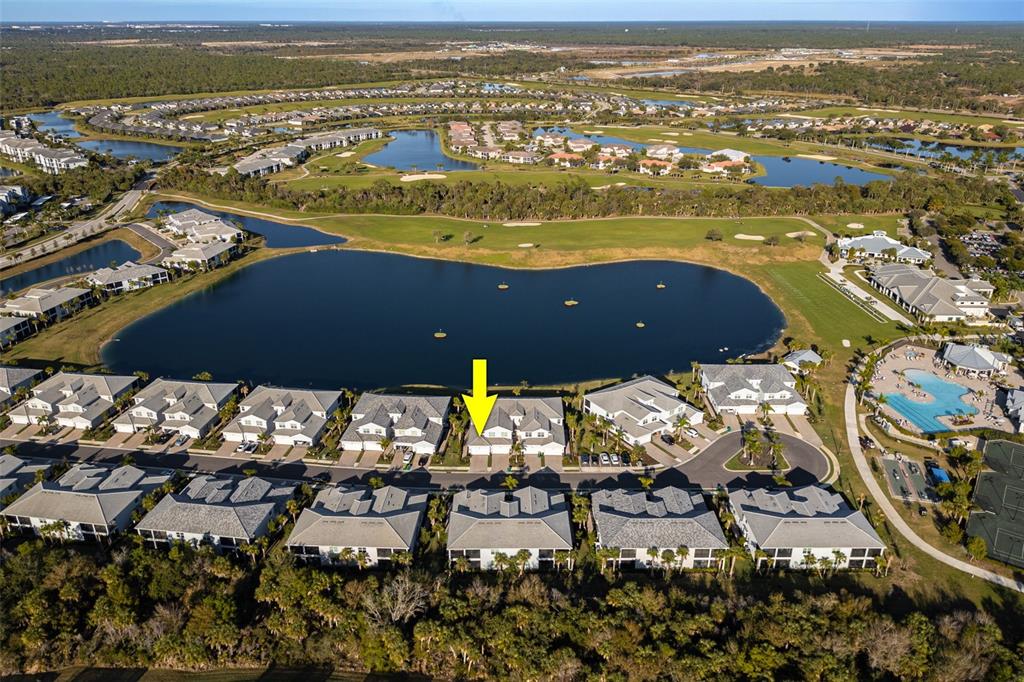 14186 Poppy Fld Loop, Unit 4911 Punta Gorda, FL 33955 - Photo 2 of 48 an aerial view of ocean and residential houses with outdoor space