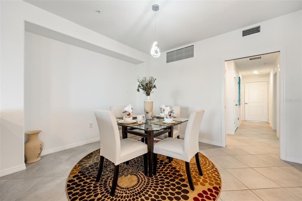 14186 Poppy Fld Loop, Unit 4911 Punta Gorda, FL 33955 - Photo 21 of 48 a dining room with furniture and window