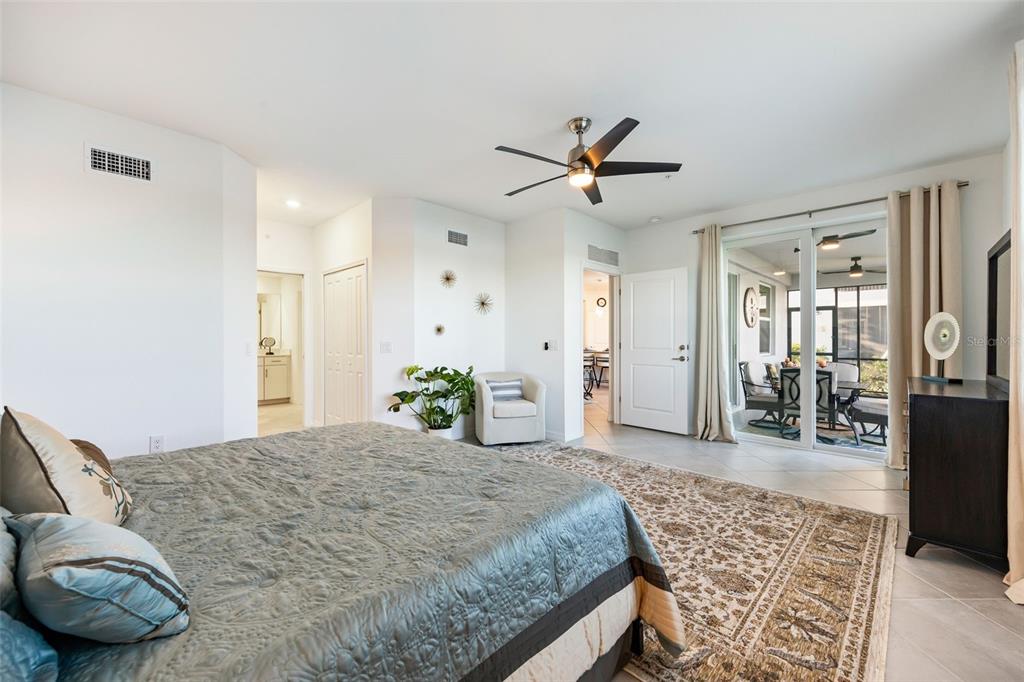 14186 Poppy Fld Loop, Unit 4911 Punta Gorda, FL 33955 - Photo 23 of 48 a living room with furniture and wooden floor