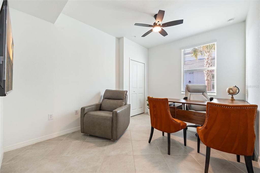 14186 Poppy Fld Loop, Unit 4911 Punta Gorda, FL 33955 - Photo 27 of 48 a living room with furniture and a window