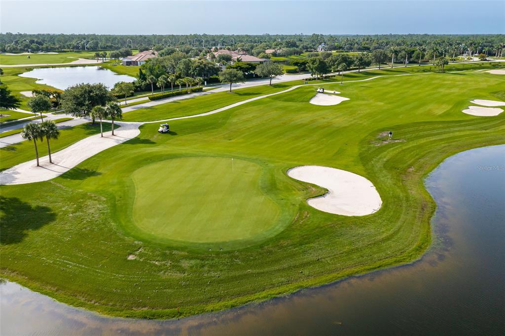 14186 Poppy Fld Loop, Unit 4911 Punta Gorda, FL 33955 - Photo 35 of 48 a view of a swimming pool and an ocean view