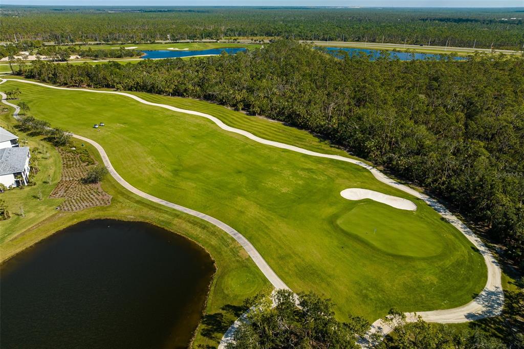 14186 Poppy Fld Loop, Unit 4911 Punta Gorda, FL 33955 - Photo 38 of 48 a view of a lake with a city