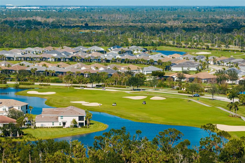 14186 Poppy Fld Loop, Unit 4911 Punta Gorda, FL 33955 - Photo 39 of 48 a view of a lake with a city