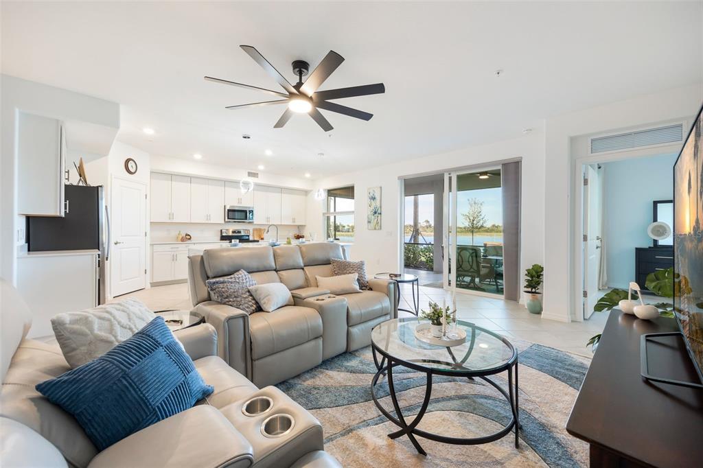 14186 Poppy Fld Loop, Unit 4911 Punta Gorda, FL 33955 - Photo 4 of 48 a living room with furniture and a large window