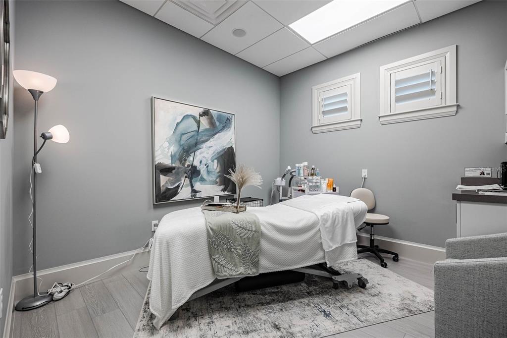 14186 Poppy Fld Loop, Unit 4911 Punta Gorda, FL 33955 - Photo 47 of 48 a bedroom with a bed and wooden floor