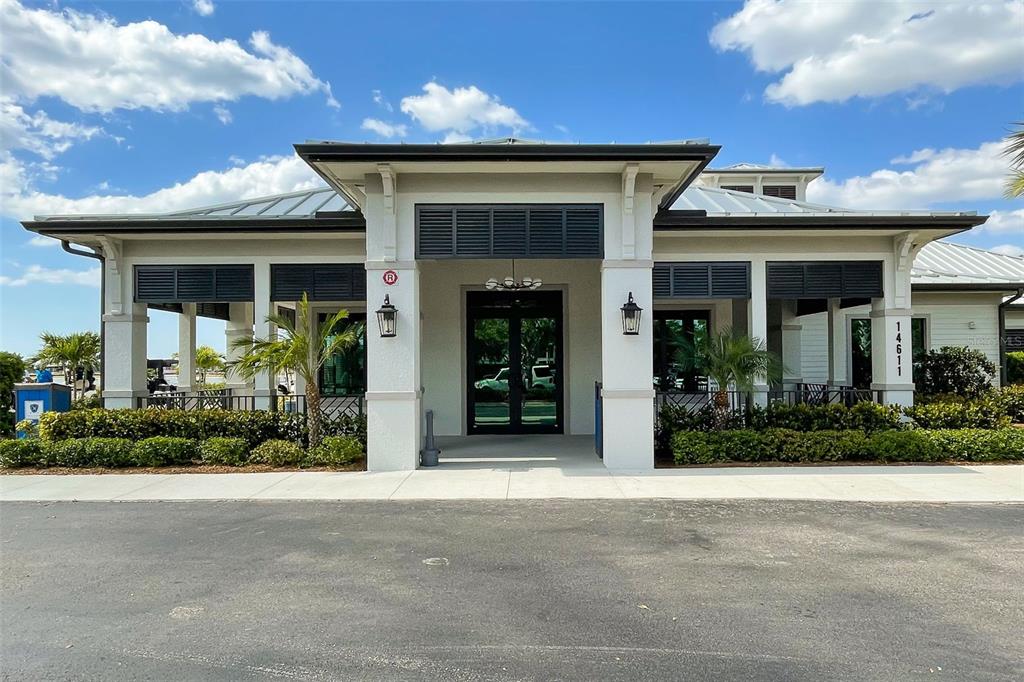 14186 Poppy Fld Loop, Unit 4911 Punta Gorda, FL 33955 - Photo 48 of 48 a front view of a house with garden