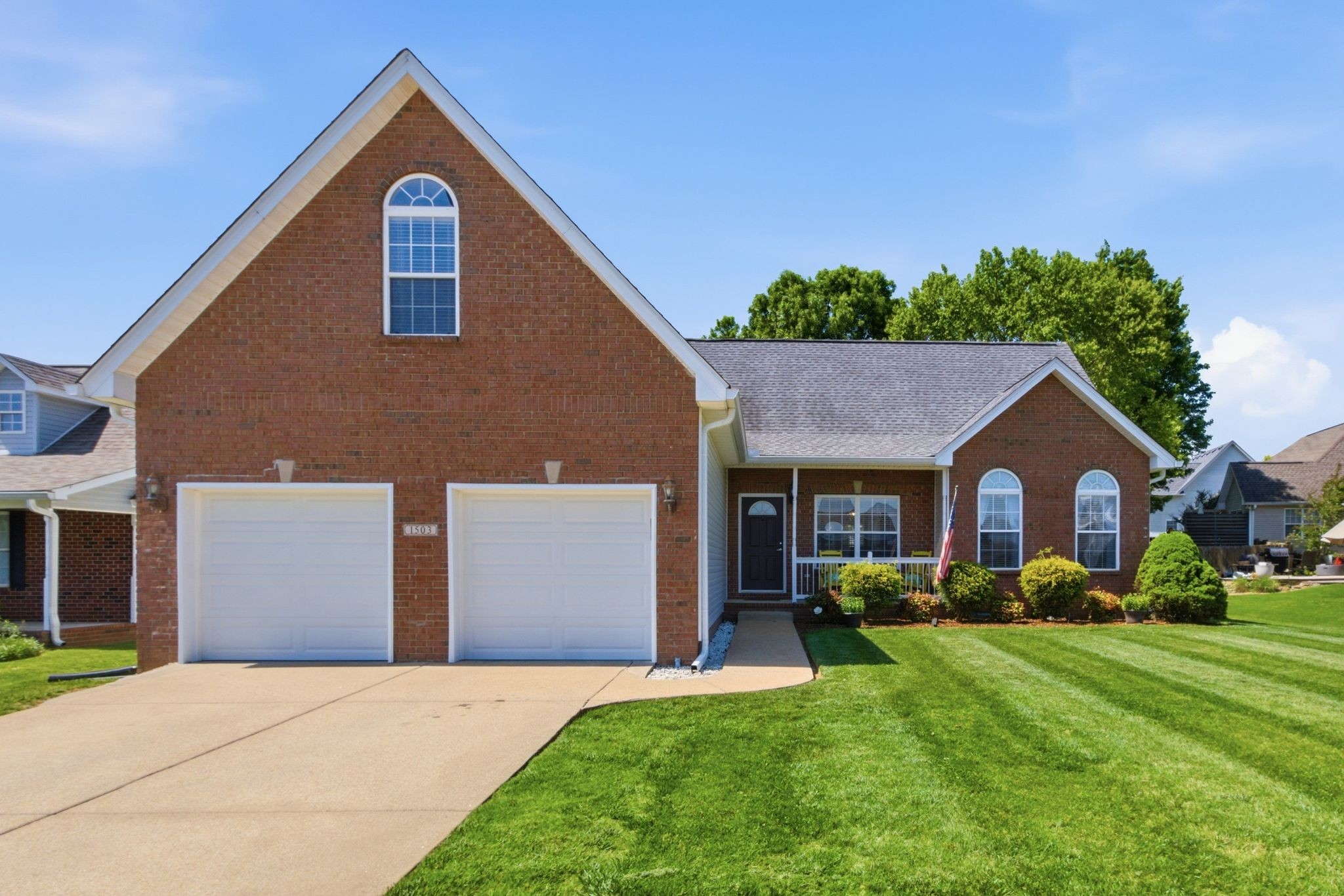 1503 Chapman Lane Spring Hill, TN 37174 - Photo 2 of 33 a front view of a house with a yard and garage