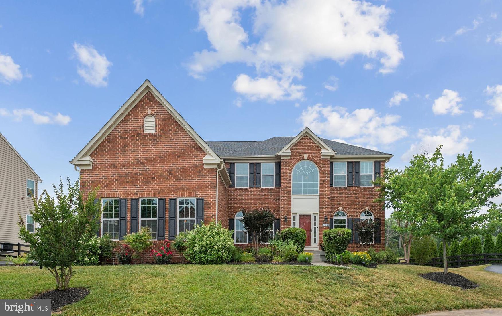 41634 Ramblin Court Ashburn, VA 20148 - Photo 1 of 56 a front view of house with yard and green space