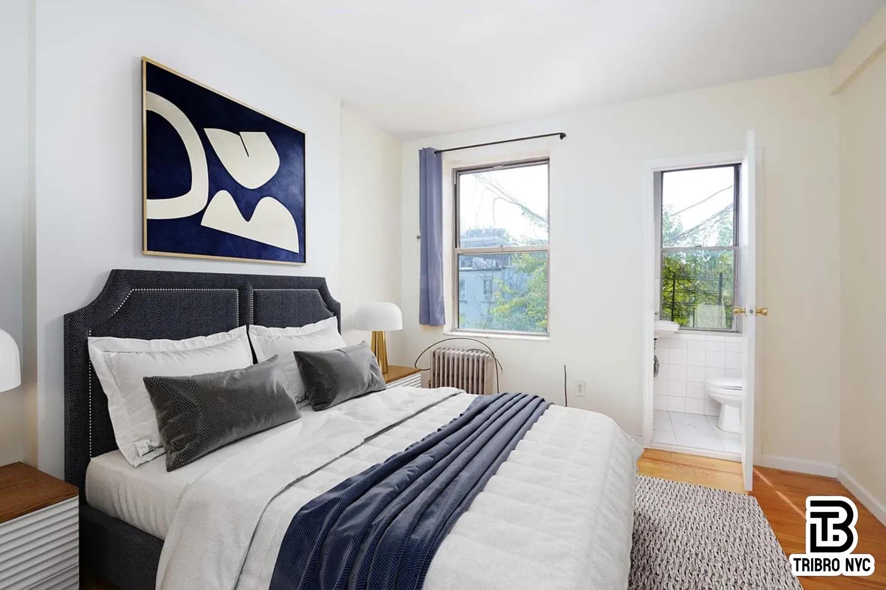 102 Baltic Street, Unit 4C Brooklyn, NY 11201 - Photo 4 of 6 a bedroom with a bed and glass window