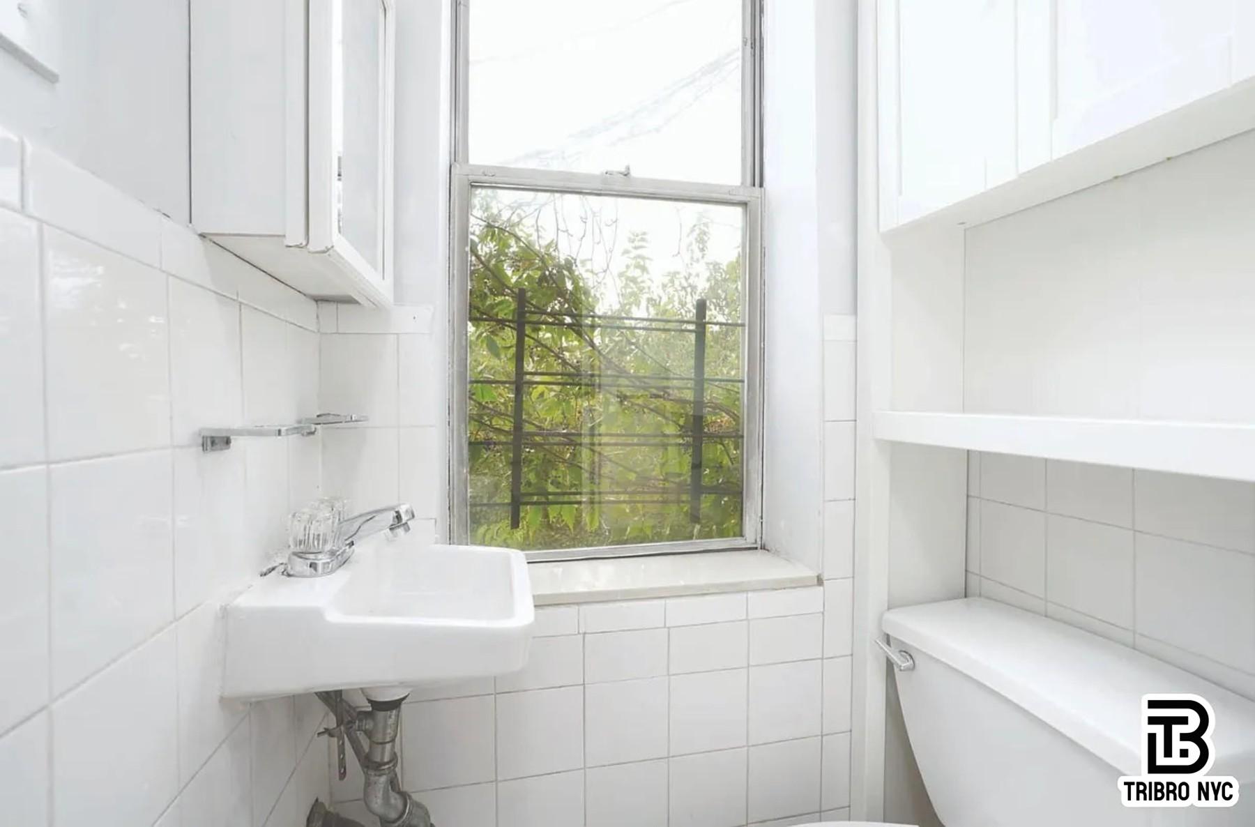 102 Baltic Street, Unit 4C Brooklyn, NY 11201 - Photo 6 of 6 a bathroom with a sink and a toilet