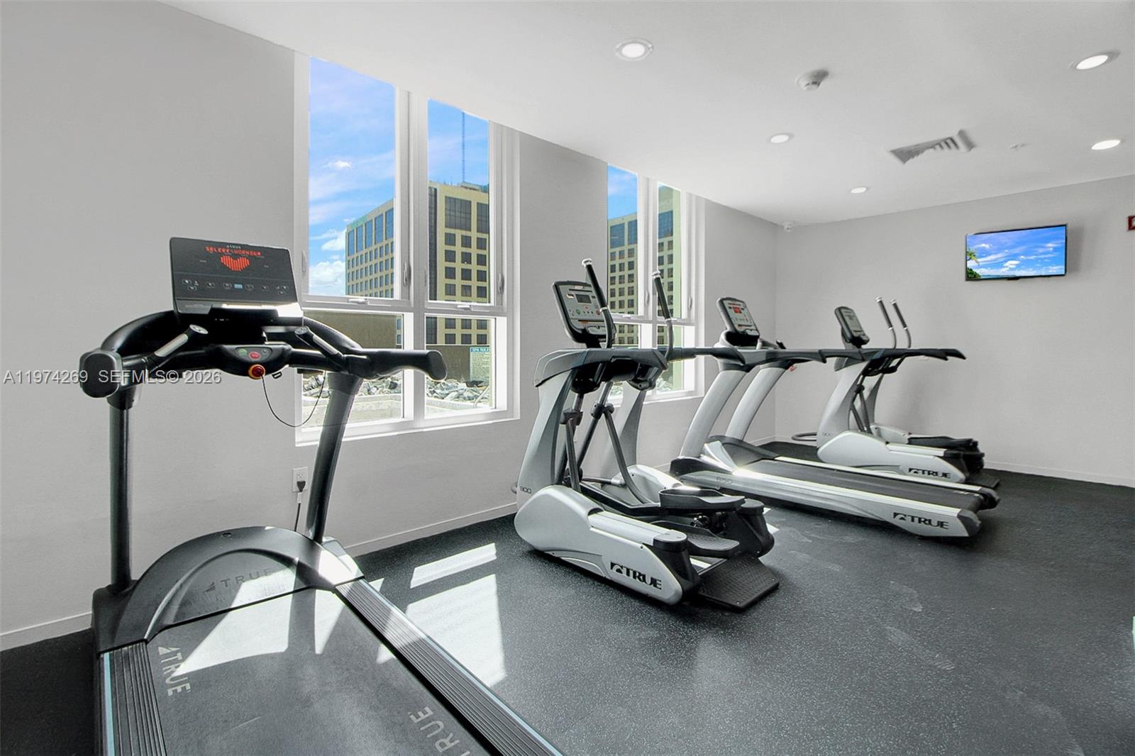 9066 Southwest 73rd Court, Unit 203 Miami, FL 33156 - Photo 15 of 28 a view of a room with gym equipment