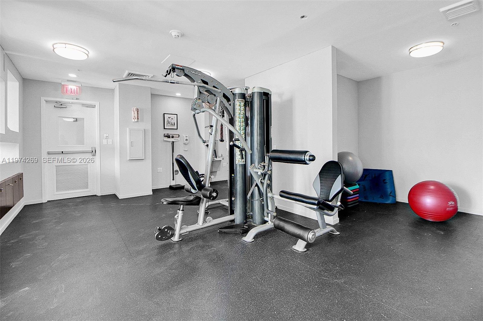 9066 Southwest 73rd Court, Unit 203 Miami, FL 33156 - Photo 17 of 28 a view of a room with gym equipment