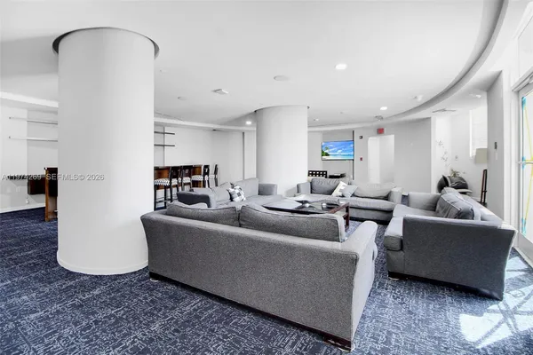 a view of dining room with furniture and chandelier