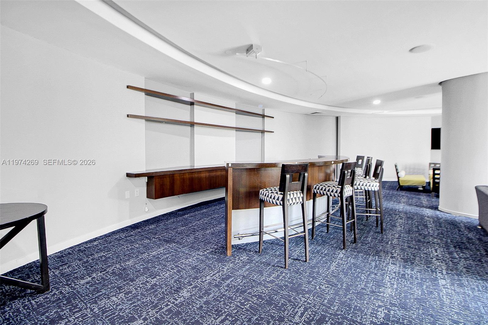 9066 Southwest 73rd Court, Unit 203 Miami, FL 33156 - Photo 21 of 28 a view of dining room with furniture and chandelier