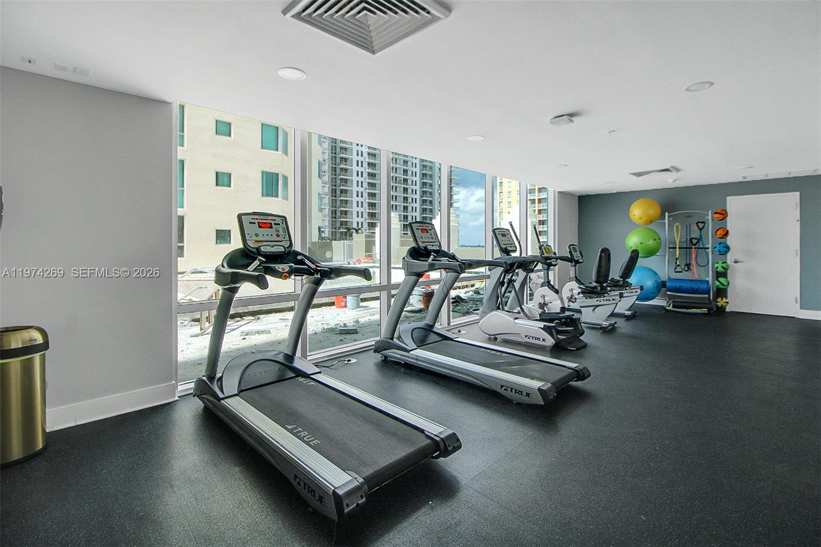 9066 Southwest 73rd Court, Unit 203 Miami, FL 33156 - Photo 25 of 28 a view of a room with gym equipment