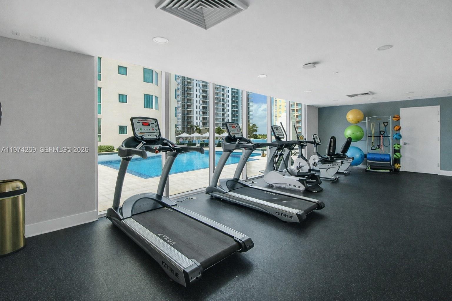 9066 Southwest 73rd Court, Unit 203 Miami, FL 33156 - Photo 26 of 28 a view of a room with gym equipment