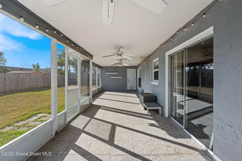a view of a backyard with wooden fence