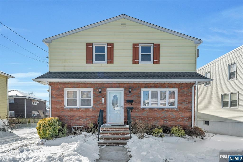 648 Milton Avenue Lyndhurst, NJ 07071 - Photo 1 of 29 a front view of a house with a garden
