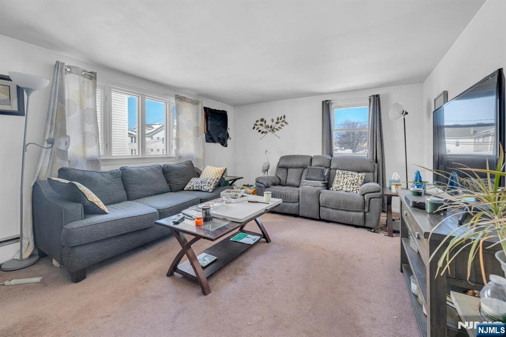 648 Milton Avenue Lyndhurst, NJ 07071 - Photo 13 of 29 a living room with furniture and a large window