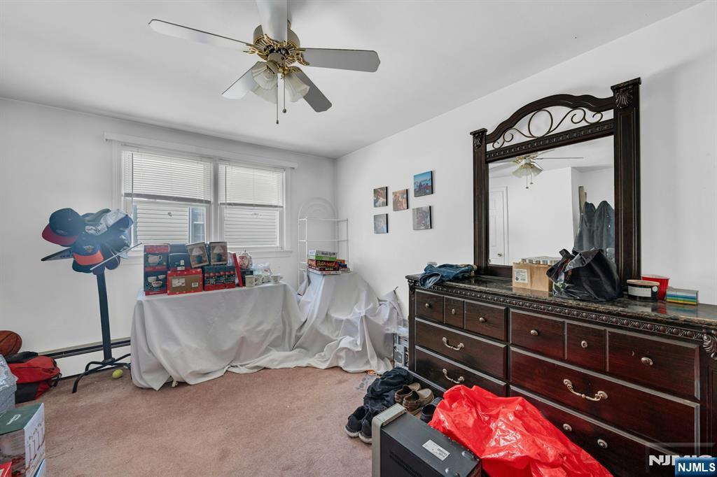 648 Milton Avenue Lyndhurst, NJ 07071 - Photo 17 of 29 a living room with a couch and a dresser