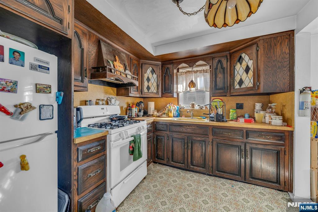 648 Milton Avenue Lyndhurst, NJ 07071 - Photo 20 of 29 a kitchen with stainless steel appliances granite countertop a refrigerator and a sink