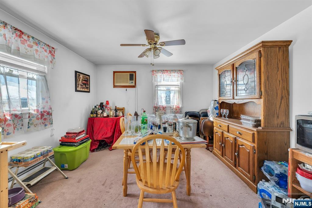 648 Milton Avenue Lyndhurst, NJ 07071 - Photo 21 of 29 a living room with furniture fireplace and a window