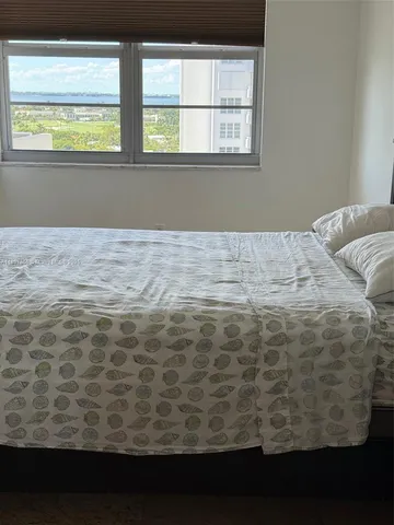 a view of a closet area with wooden floor
