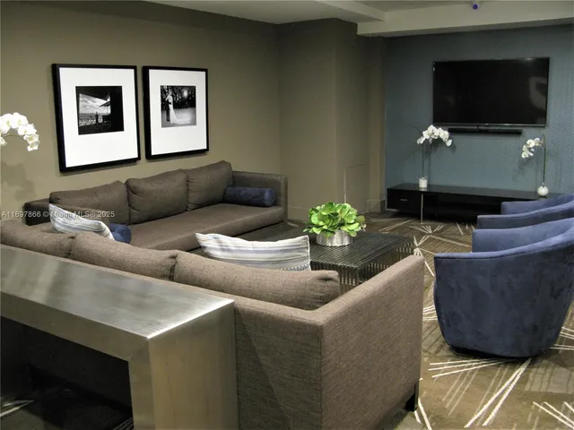 a room with furniture and book shelf