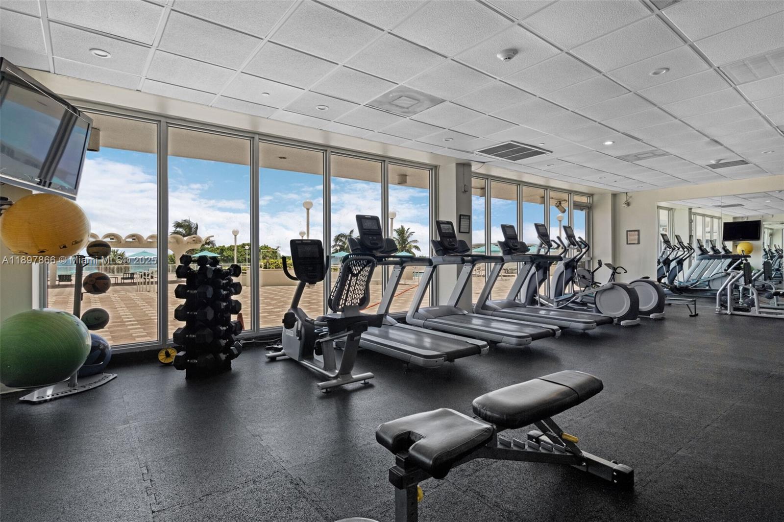 5701 Collins Avenue, Unit 1207 Miami Beach, FL 33140 - Photo 31 of 44 a view of a room with gym equipment