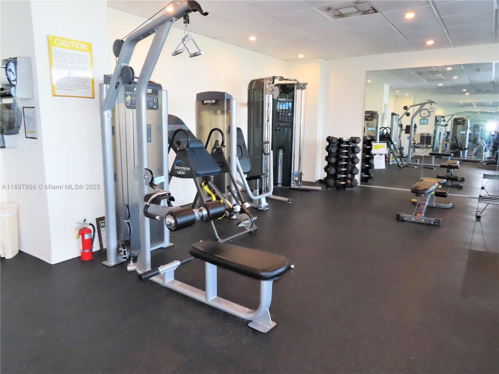 5701 Collins Avenue, Unit 1207 Miami Beach, FL 33140 - Photo 32 of 44 a view of a room with gym equipment