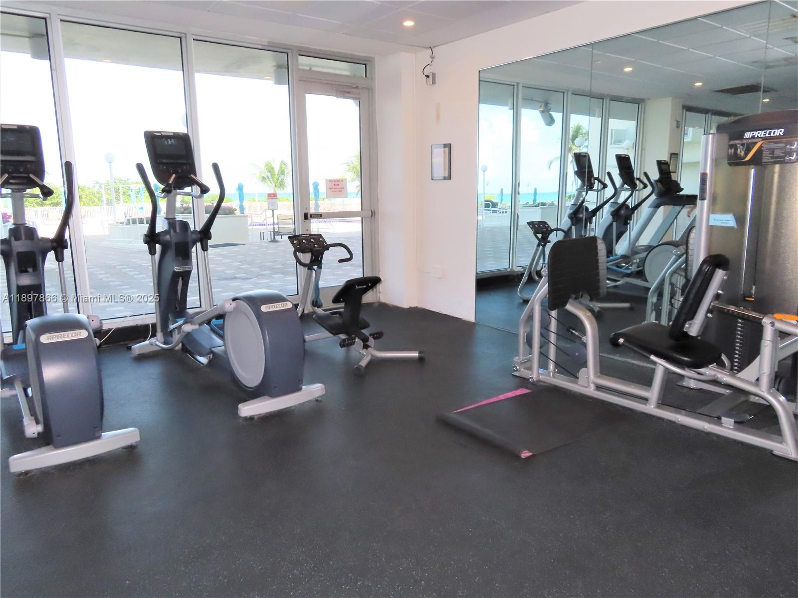 5701 Collins Avenue, Unit 1207 Miami Beach, FL 33140 - Photo 33 of 44 a view of a room with gym equipment