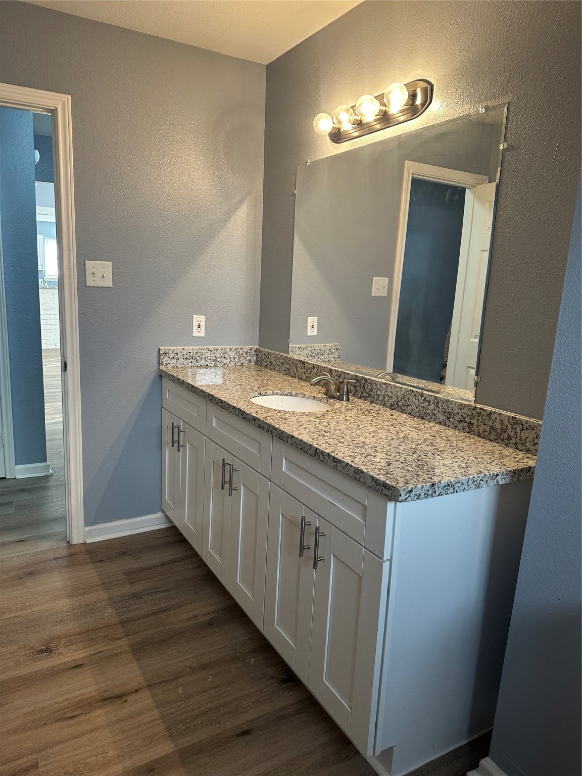15770 Chimney Rock Road Houston, TX 77489 - Photo 25 of 42 a bathroom with a granite countertop double vanity sink and a mirror