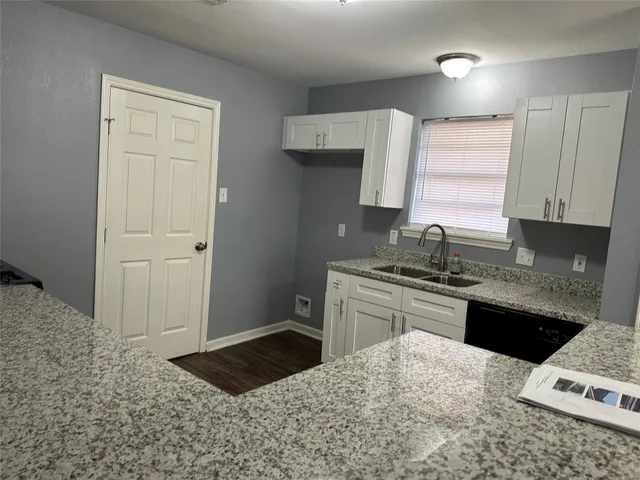 a kitchen with a sink stove and refrigerator