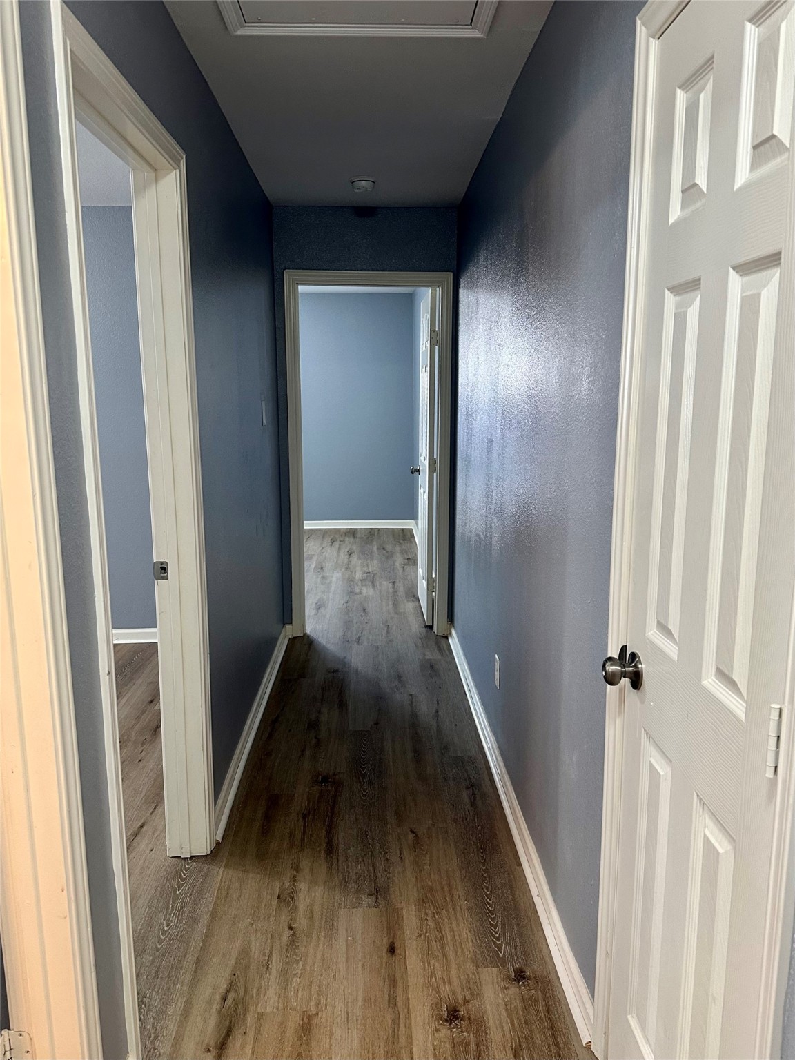15770 Chimney Rock Road Houston, TX 77489 - Photo 38 of 42 a view of a hallway with wooden floor and staircase