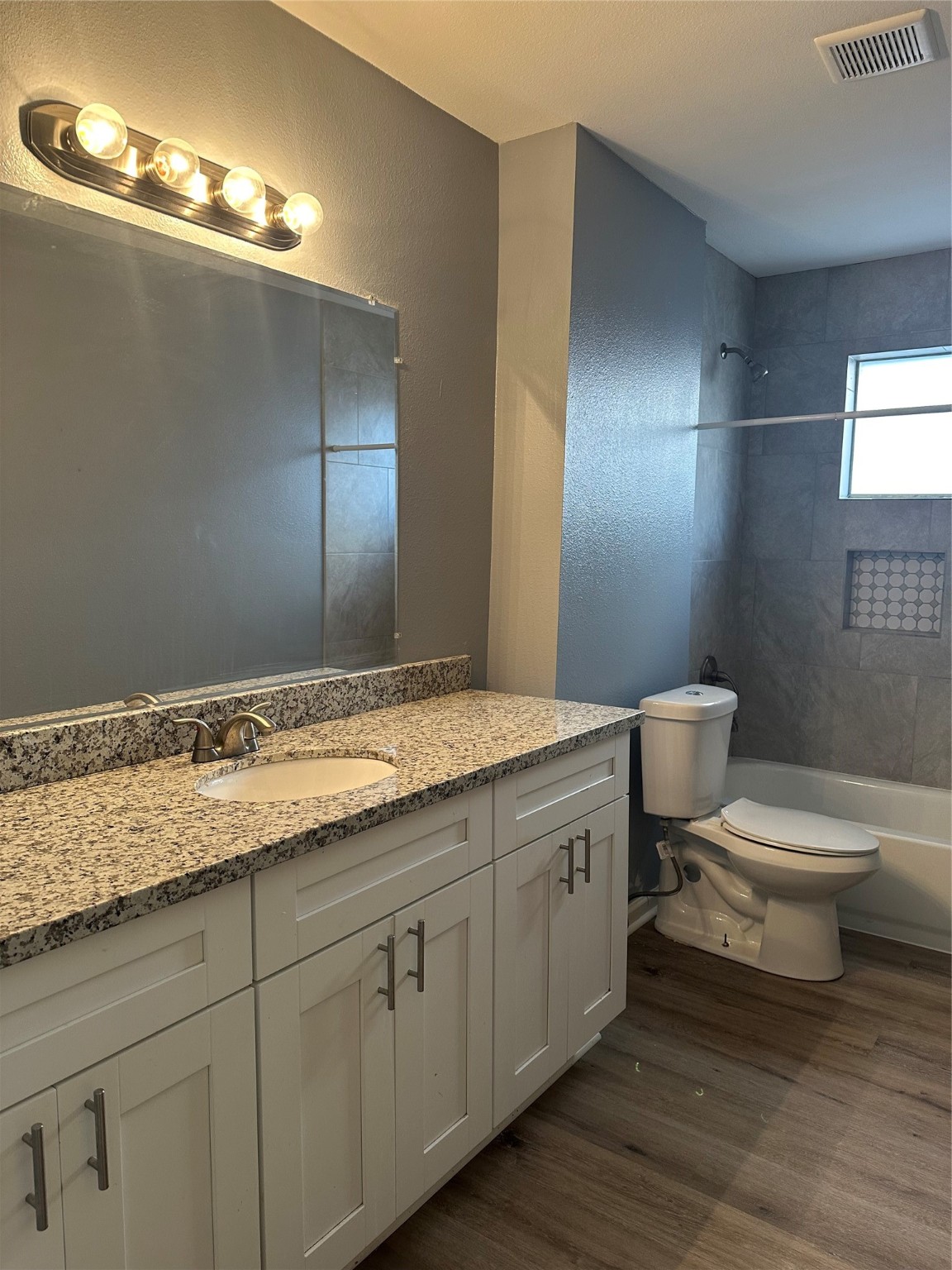 15770 Chimney Rock Road Houston, TX 77489 - Photo 39 of 42 a bathroom with a granite countertop toilet sink and mirror