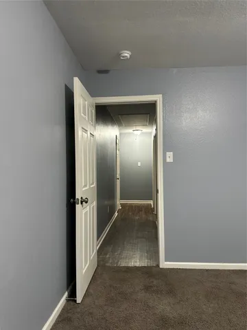 an empty room with mirror