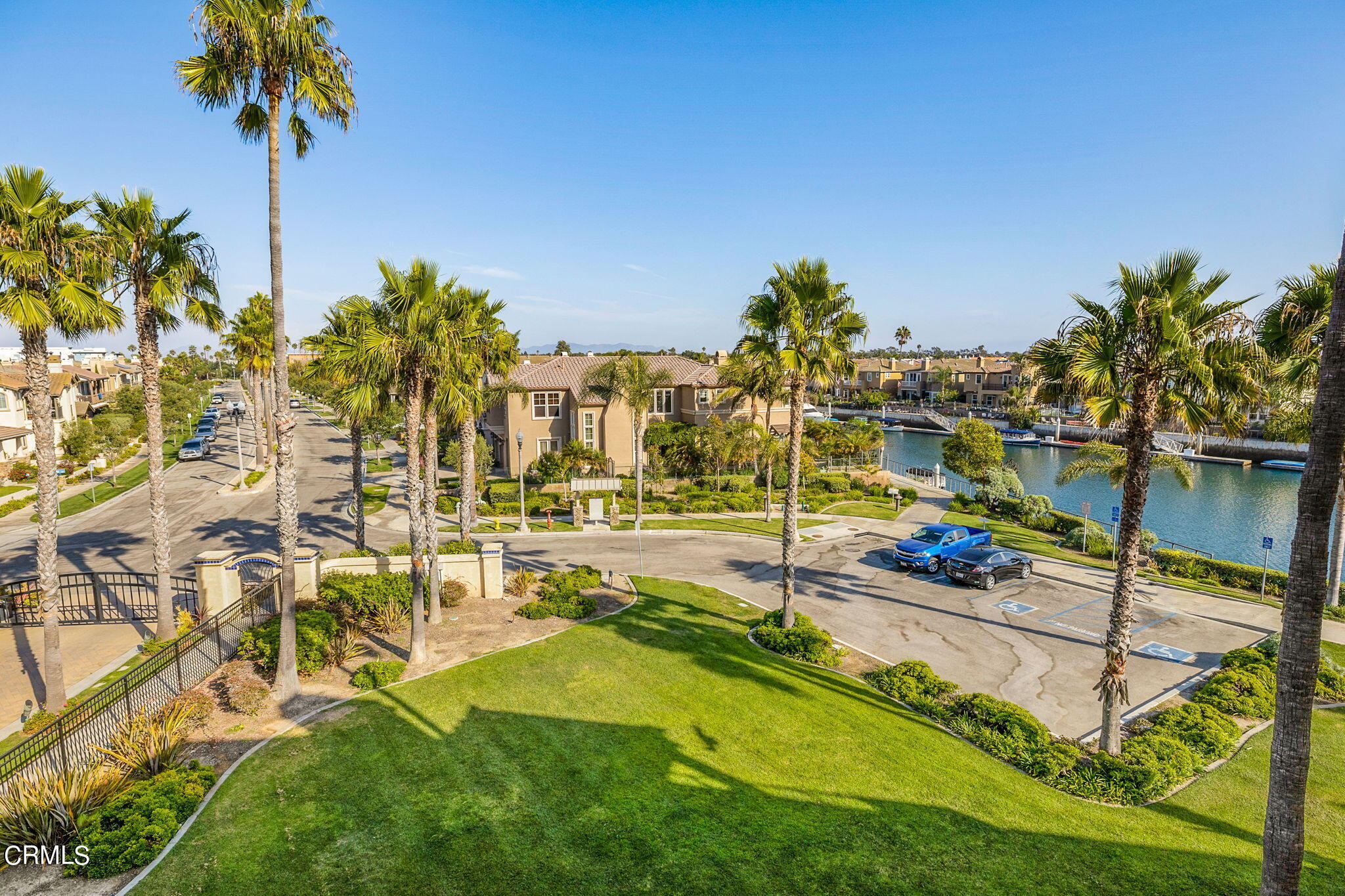 4212 Harbour Island Lane Oxnard, CA 93035 - Photo 16 of 48 a view of a swimming pool with a bench and lawn chairs
