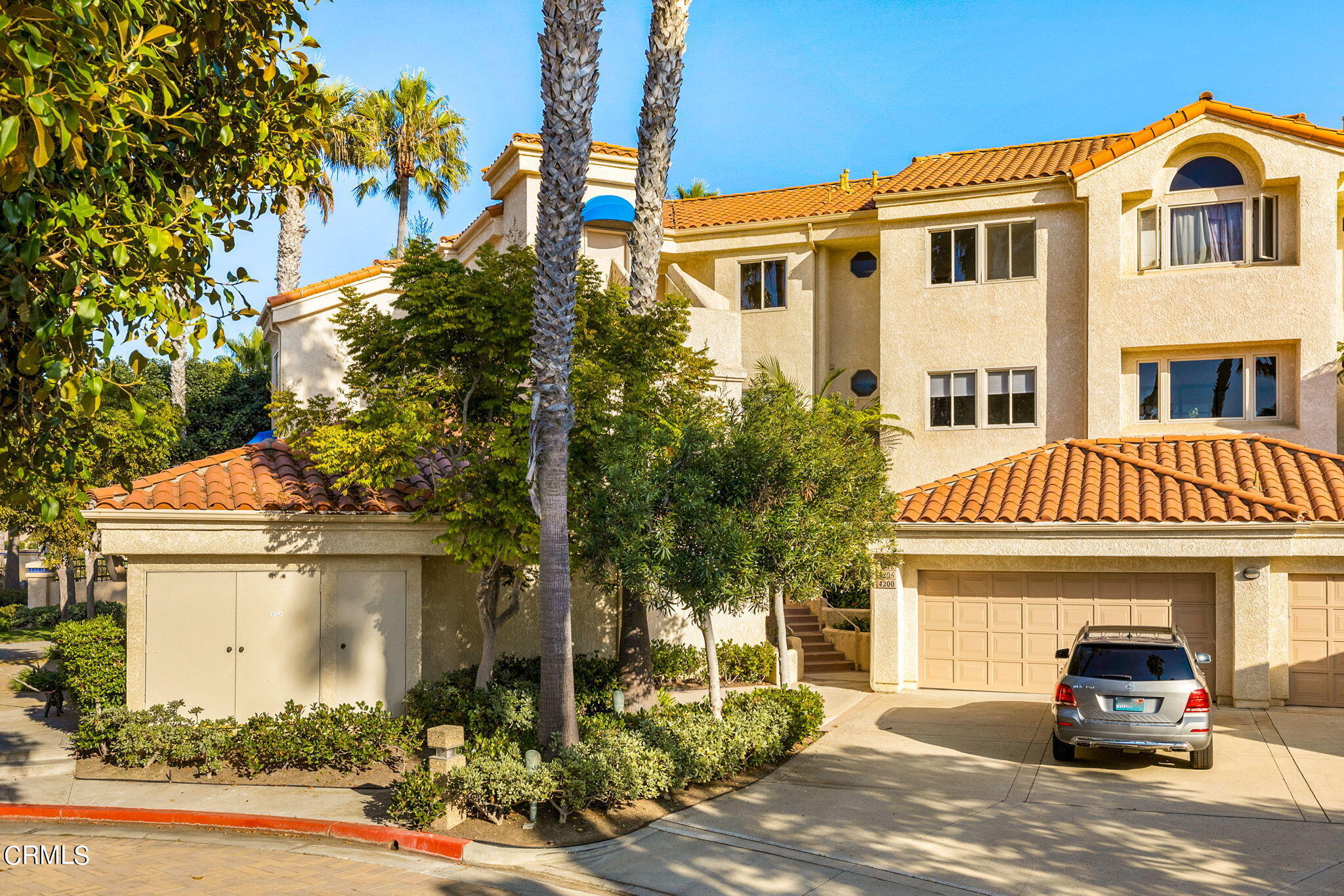 4212 Harbour Island Lane Oxnard, CA 93035 - Photo 3 of 48 a front view of a house with a yard