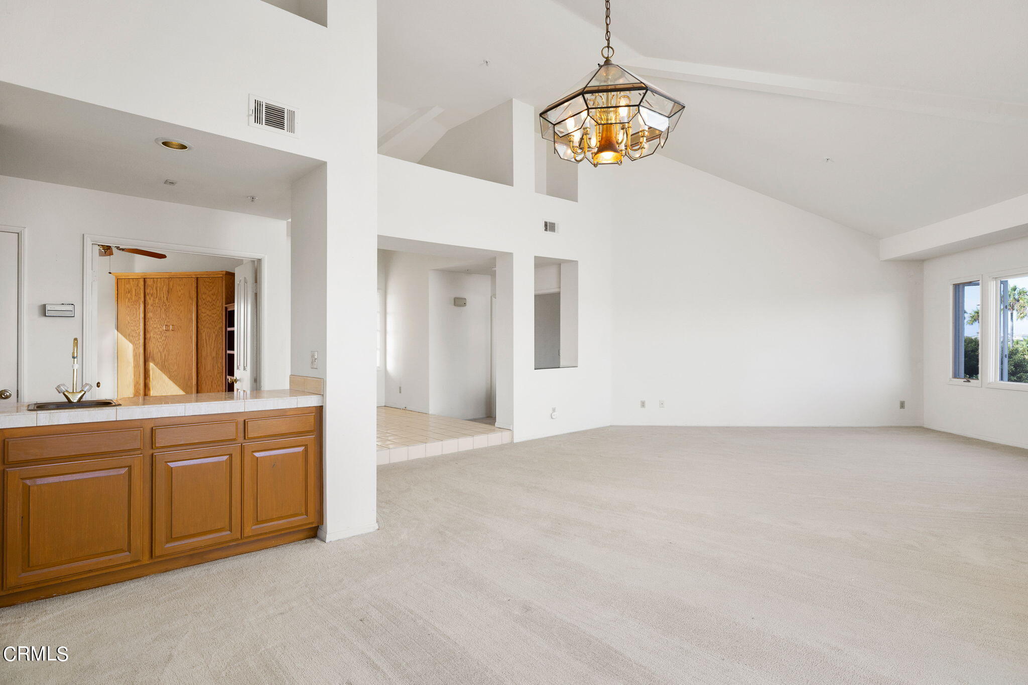 4212 Harbour Island Lane Oxnard, CA 93035 - Photo 21 of 48 a view of a kitchen with a sink cabinet and a window
