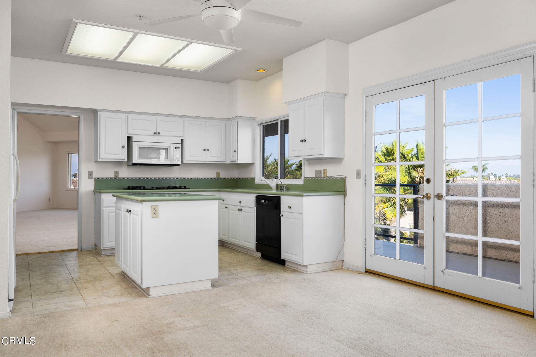 4212 Harbour Island Lane Oxnard, CA 93035 - Photo 22 of 48 a kitchen with a stove a refrigerator and a cabinets