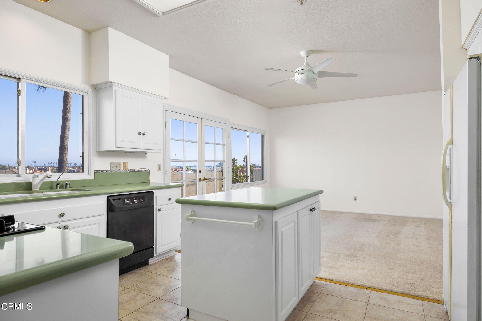 4212 Harbour Island Lane Oxnard, CA 93035 - Photo 24 of 48 a kitchen with granite countertop a sink and cabinets