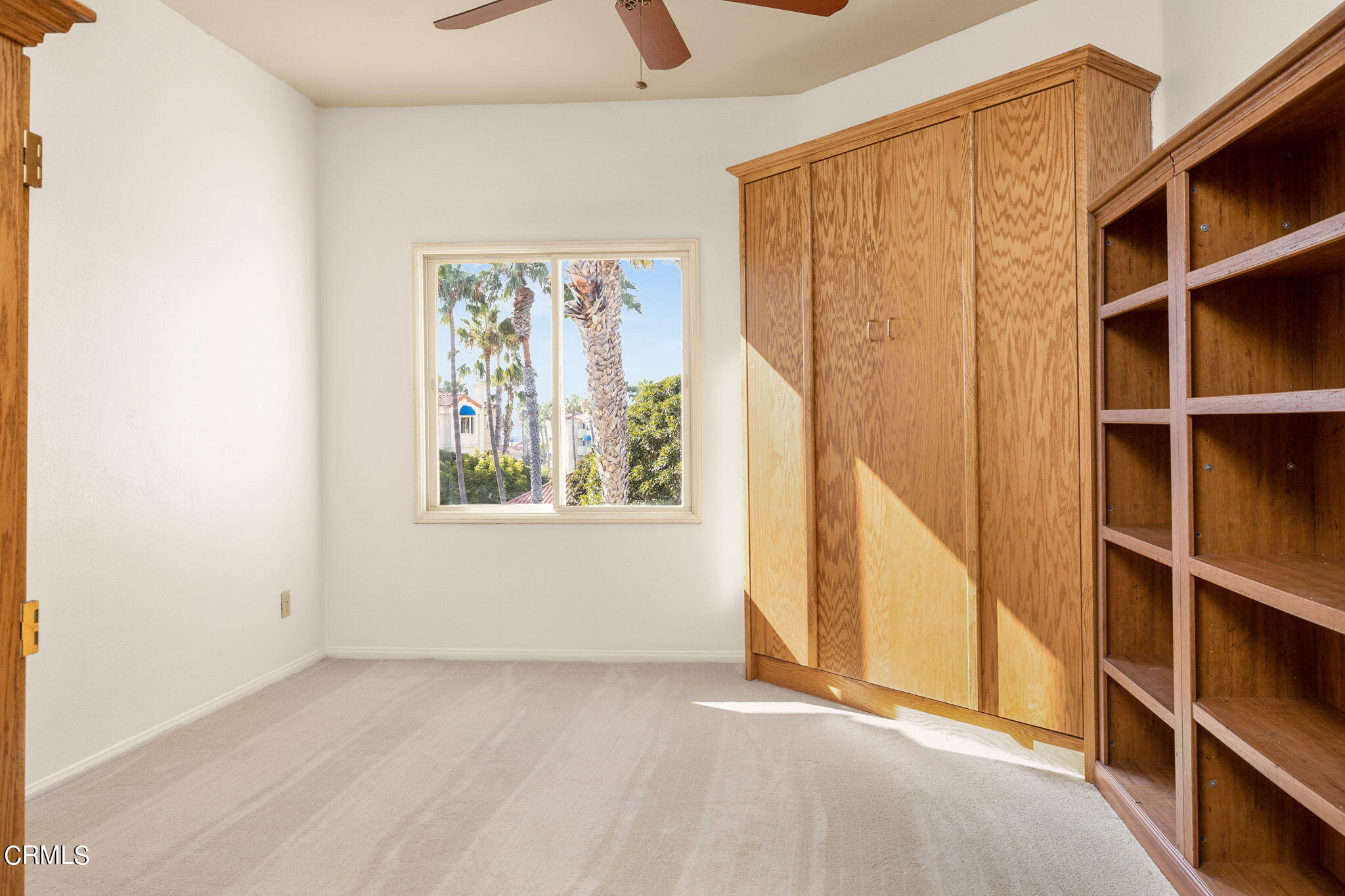 4212 Harbour Island Lane Oxnard, CA 93035 - Photo 32 of 48 a view of an empty room with closet and a window