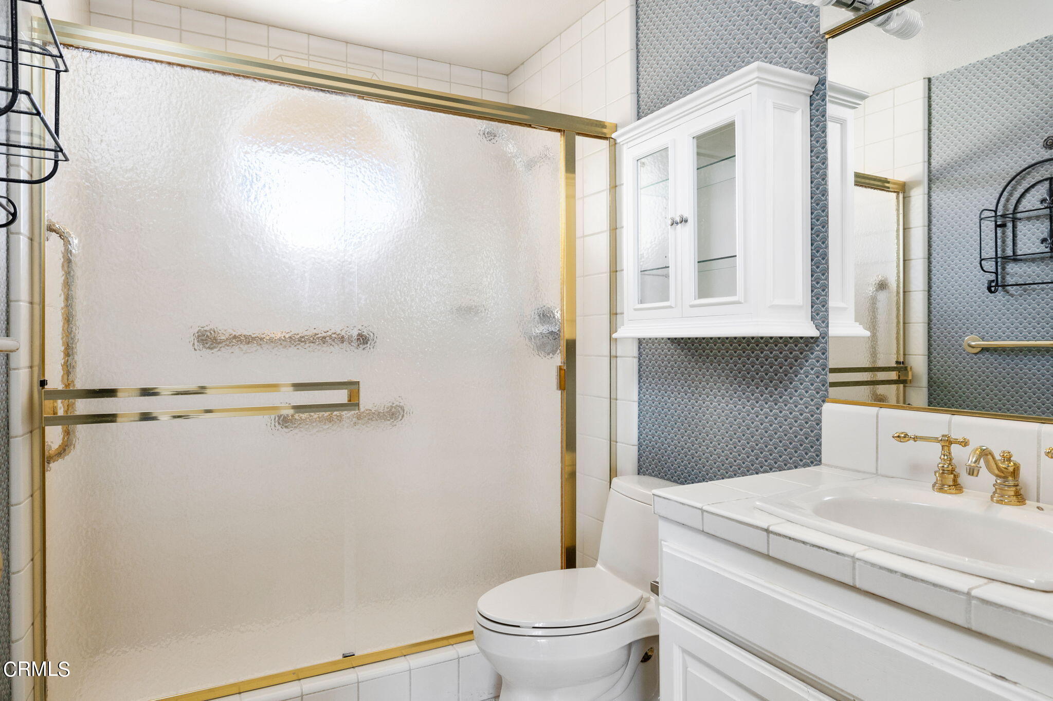 4212 Harbour Island Lane Oxnard, CA 93035 - Photo 37 of 48 a bathroom with a granite countertop sink toilet and shower