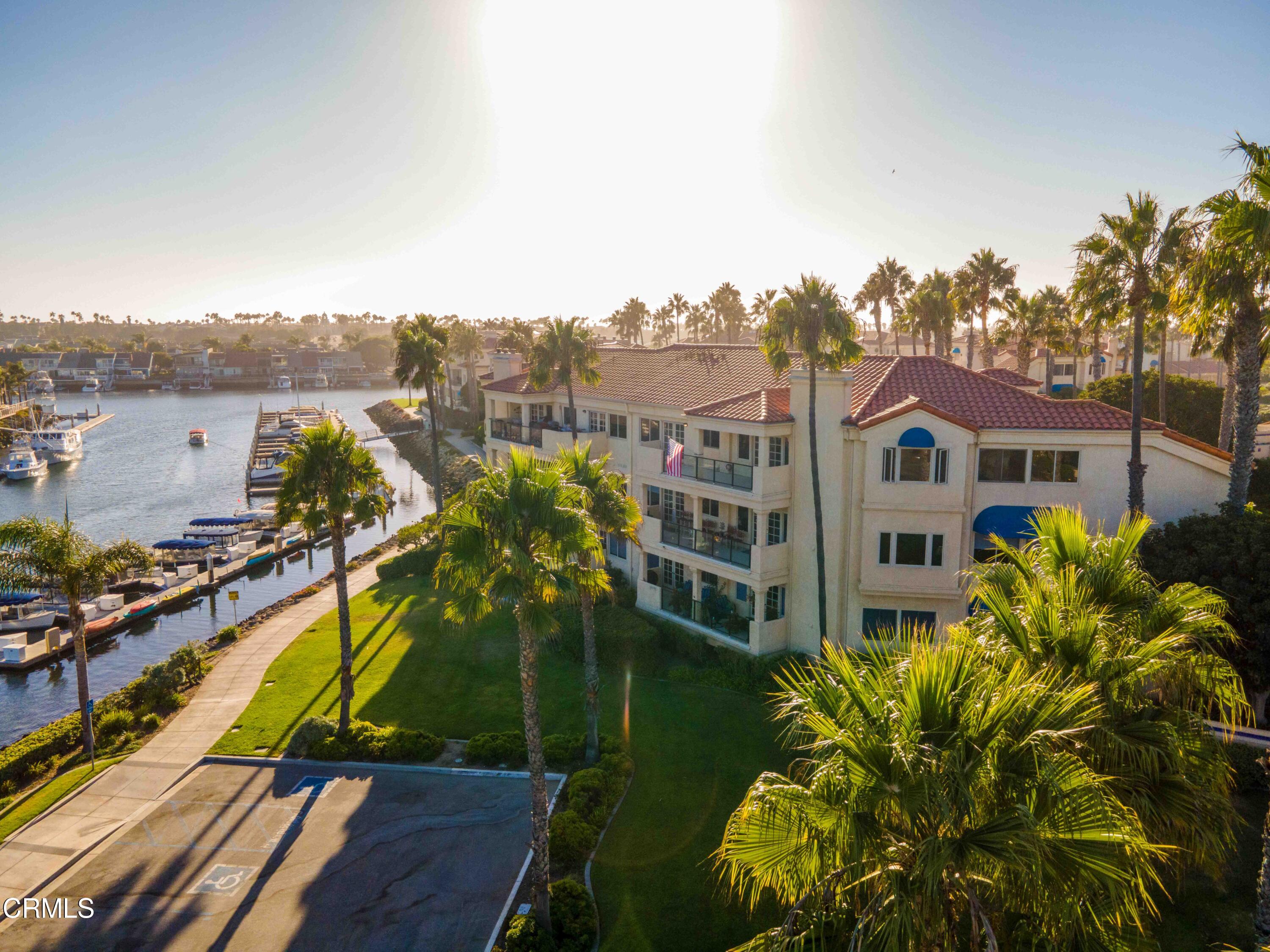 4212 Harbour Island Lane Oxnard, CA 93035 - Photo 47 of 48 a view of a lake with a building in the background