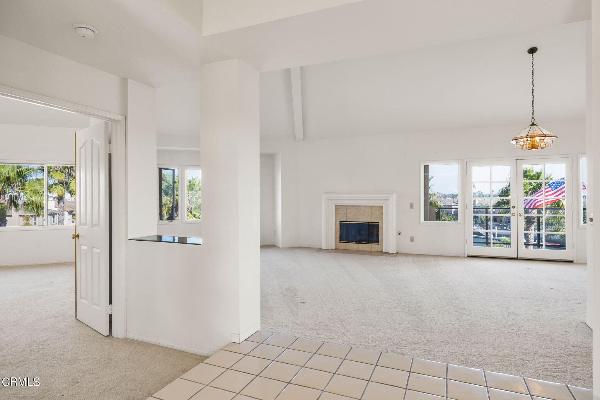 4212 Harbour Island Lane Oxnard, CA 93035 - Photo 7 of 48 a view of an empty room with a fireplace and a window