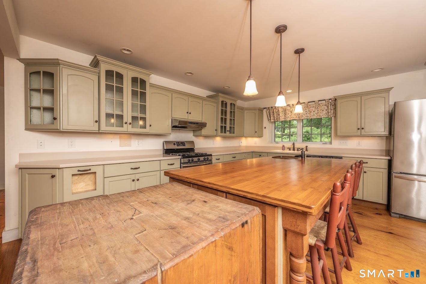 19 High Street Middlefield, CT 06455 - Photo 8 of 18 A beautifully appointed kitchen with handcrafted details, abundant cabinetry, and an oversized island made for entertaining.